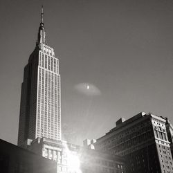 Low angle view of buildings against sky at night