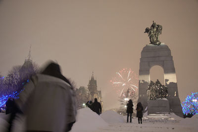 Statue in city during winter