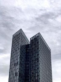 Low angle view of skyscraper against sky