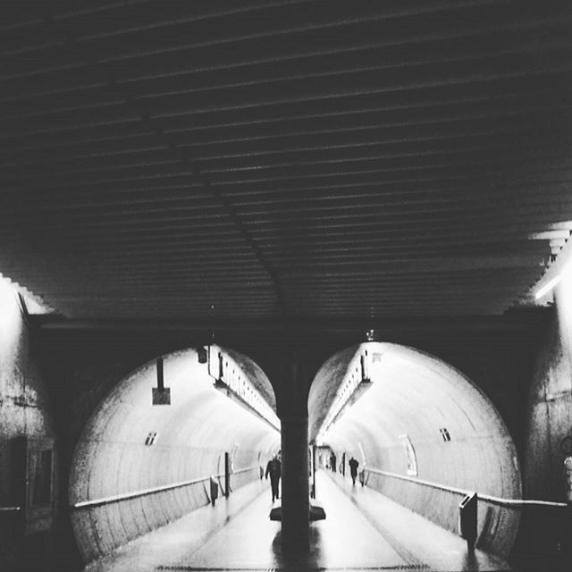 indoors, ceiling, architecture, arch, built structure, interior, illuminated, tunnel, corridor, the way forward, architectural column, transportation, lighting equipment, diminishing perspective, railroad station, subway, incidental people, in a row, empty, column