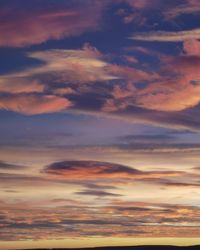 Low angle view of clouds in sky during sunset