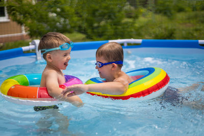 Boy swimming in pool