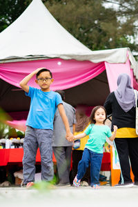 Children standing at the event in malaysia.