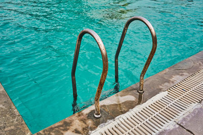 High angle view of swimming pool railing 