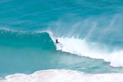 High angle view of man surfing in sea