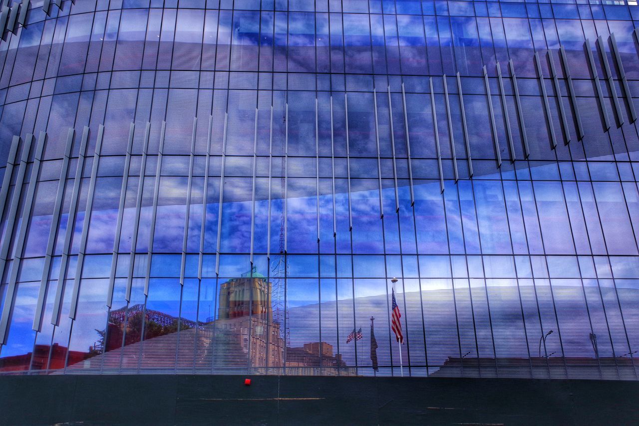 LOW ANGLE VIEW OF GLASS BUILDING