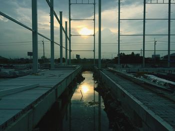 View of canal at sunset