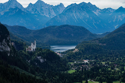 High angle view of townscape and mountains against sky