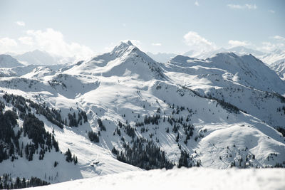 Scenic view of snowcapped mountains against sky