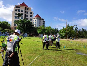 Group of people in front of buildings