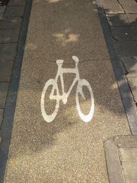 High angle view of bicycle sign on road