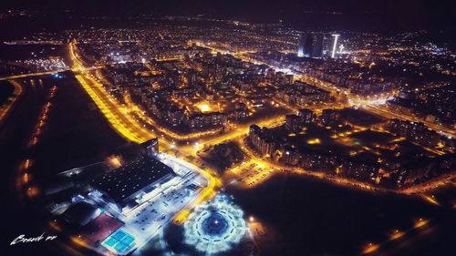 Aerial view of illuminated city at night