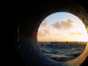 Close-up of water against clear sky during sunset