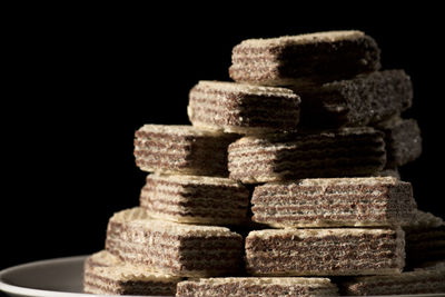 Close-up of stone stack against black background