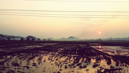 Scenic view of landscape at sunset