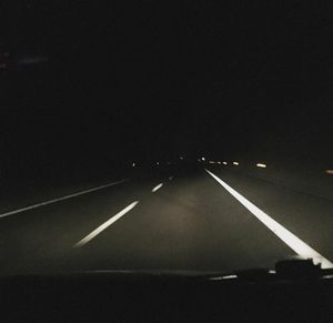 Illuminated road at night