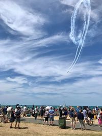 Crowd looking at airshow on beach