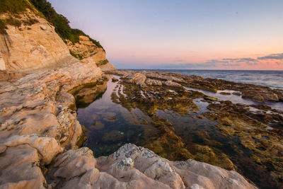 Scenic view of sea against sky at sunset