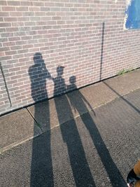 Shadow of people on street