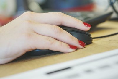 Close-up of woman working on table