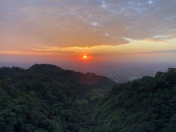 Scenic view of mountains against sky during sunset