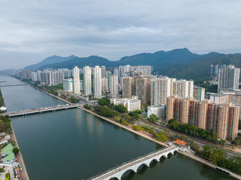 High angle view of buildings in city against sky