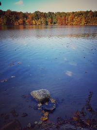 Scenic view of lake against sky during autumn