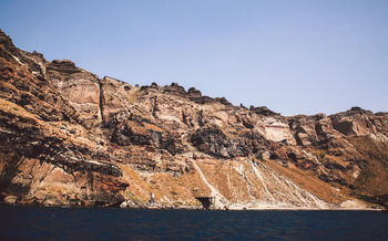 Sea against rocky mountains