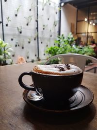Close-up of coffee cup on table