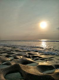 View of beach at sunset