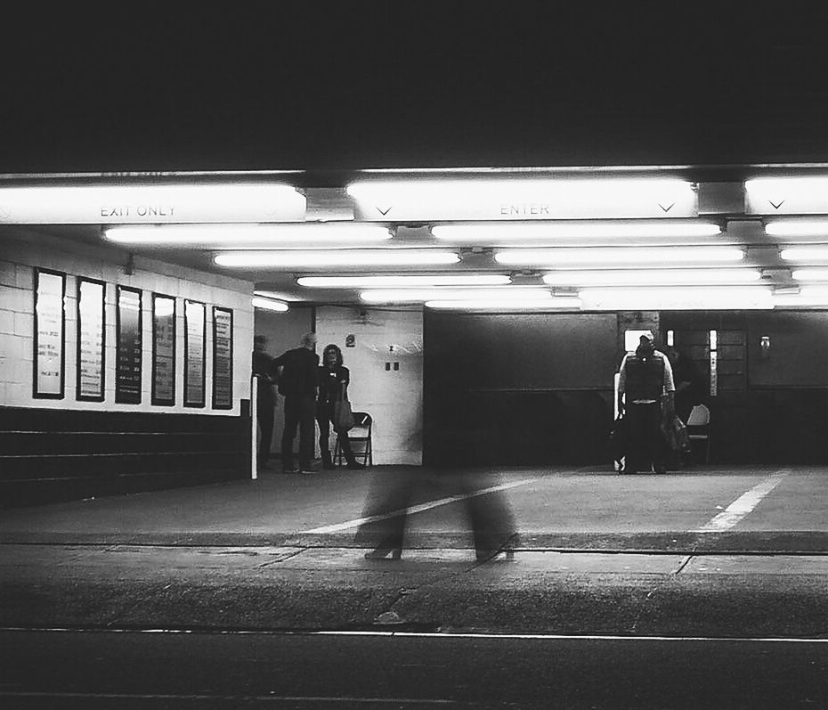 illuminated, lighting equipment, indoors, real people, railroad station, public transportation, people, men, adults only, transportation, full length, standing, subway train, adult, one person, only men, day