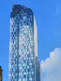 Low angle view of buildings against clear blue sky