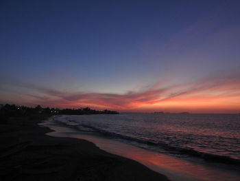 Scenic view of sea against romantic sky at sunset