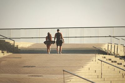 Low angle view of woman against clear sky