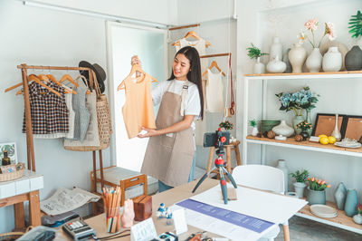 Rear view of woman standing in store