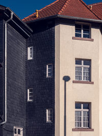 Low angle view of residential building on sunny day