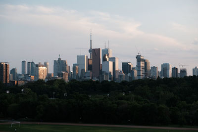 Modern buildings in city against sky