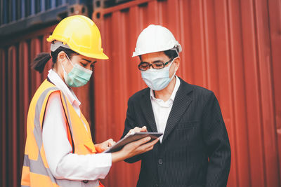 Man working with arms raised