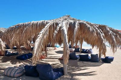 Panoramic view of beach against clear blue sky