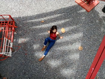 High angle view of woman on red floor