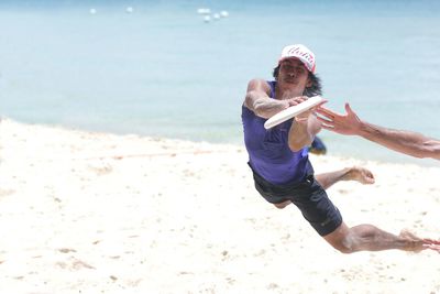 Man on beach against sky