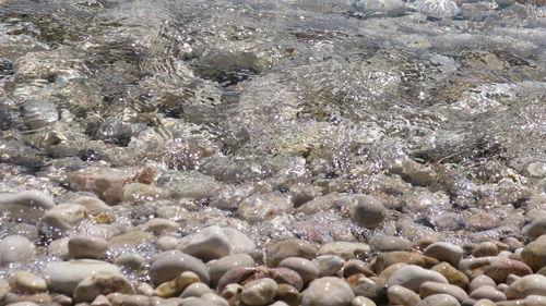 Full frame shot of pebbles at beach