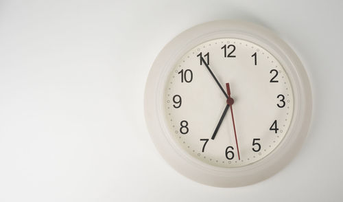 Close-up of clock on wall