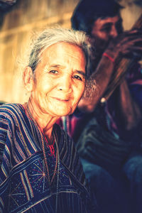 Portrait of smiling senior woman outdoors