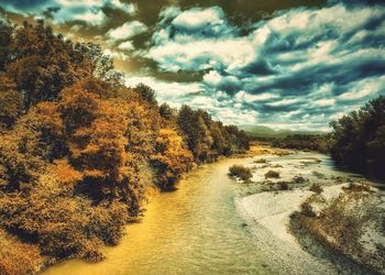 Scenic view of landscape against cloudy sky