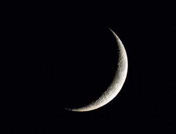 Low angle view of moon against clear sky at night