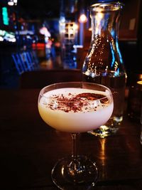 Close-up of wine glass on table