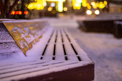 Close-up of snow on wet table