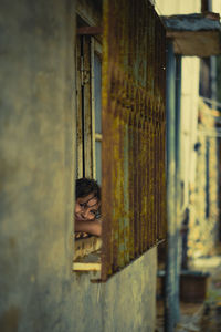 Girl looking through a window