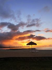 Scenic view of beach against sky during sunset